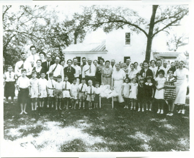 1st Fisher Family Reunion 1935 (note oddly large family members on  left, added by some photographer)