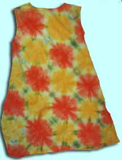 little girl's dress dip-dyed with yellow/orange flowers and green leaves