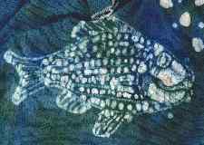 scanned detail of fish batik on cotton knit material